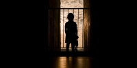 Silhouette of child in doorway