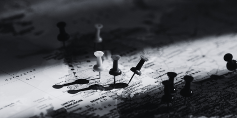 Barbara Nickless Spy Novels that take you all over the world - pins pushed into countries on a map